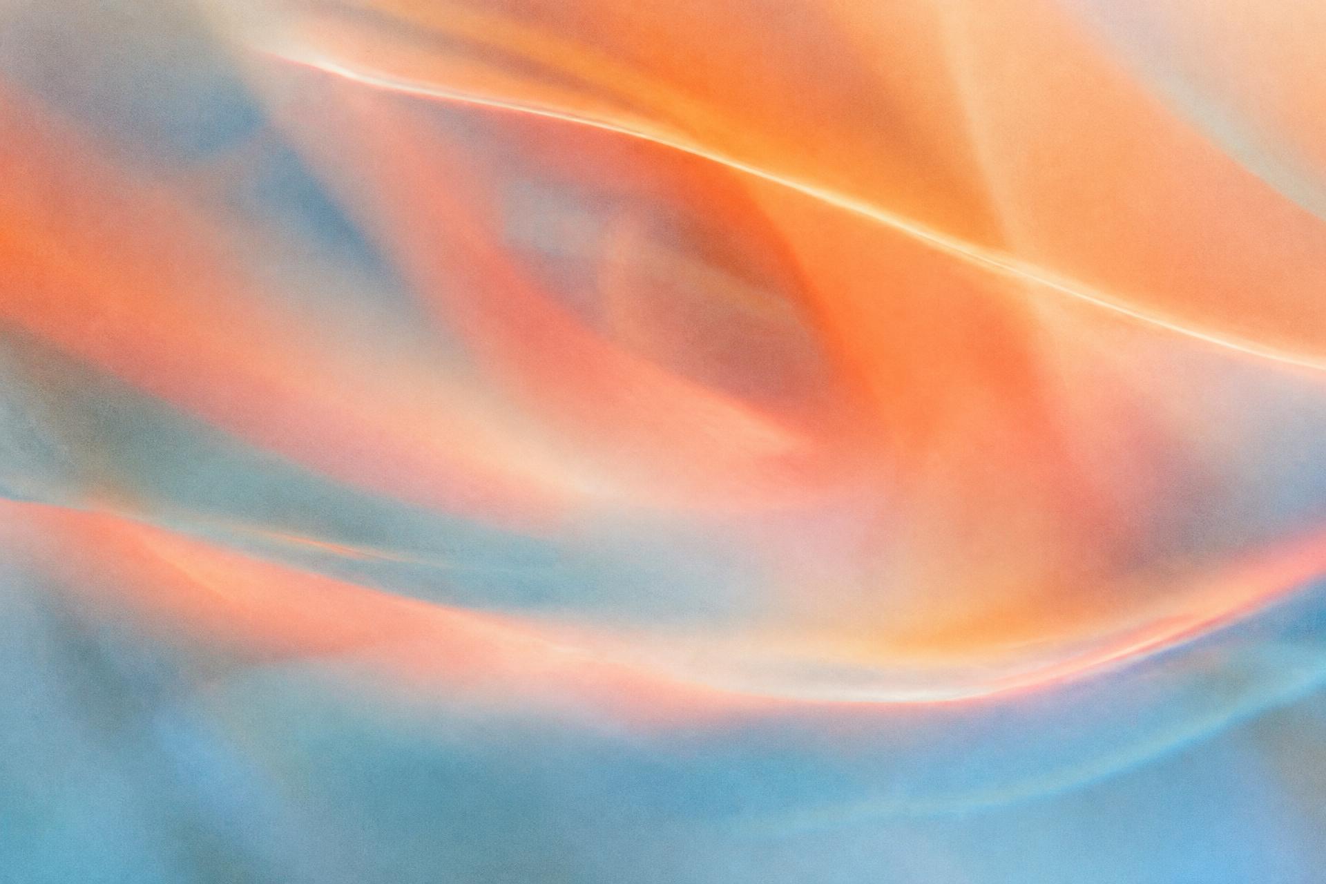 Abstract painting of sweeping peach and soft blue light