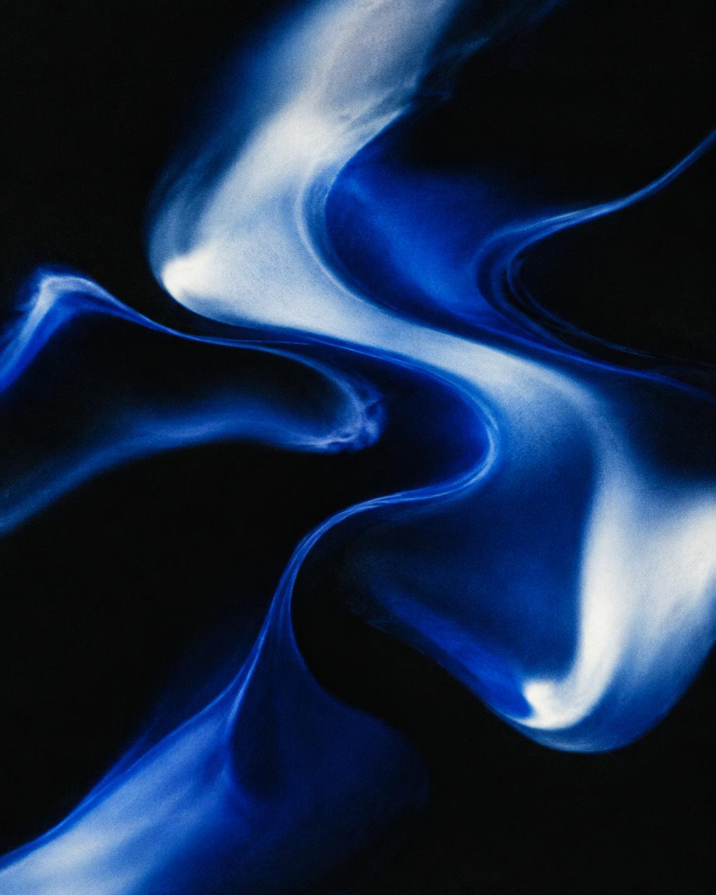Abstract painting of deep blue forms on black